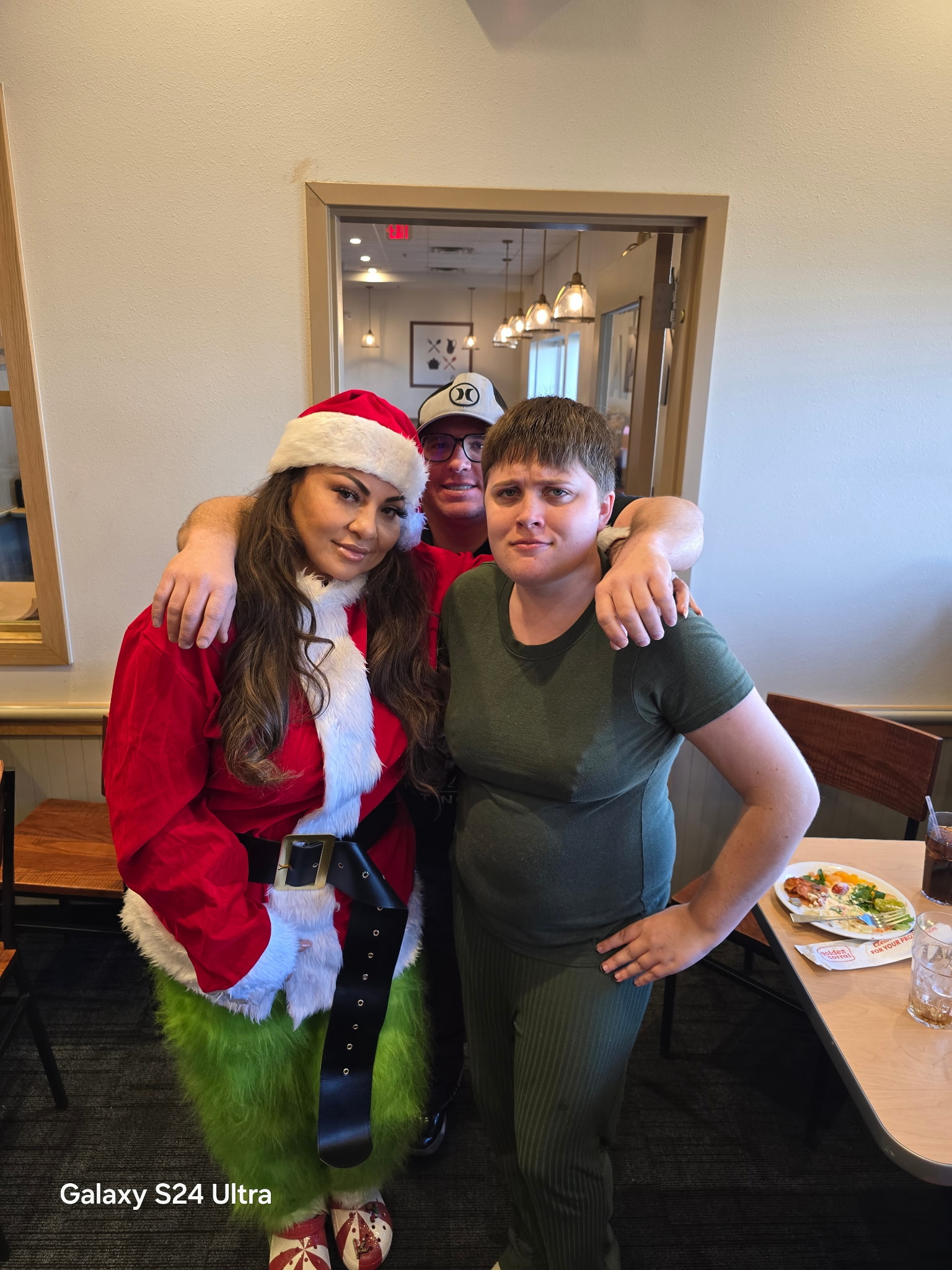 Brighter Horizon clients and host home providers celebrating together at a holiday outing in Santa costumes