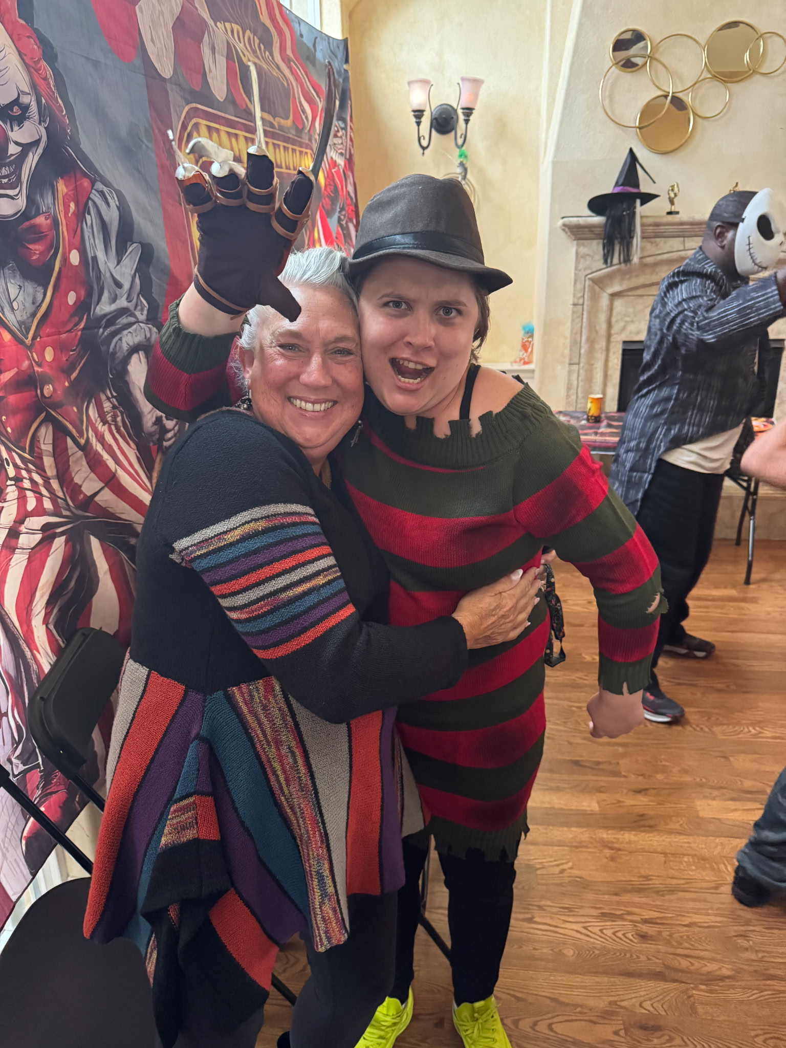 Brighter Horizon clients in costume, embracing at a Halloween community party