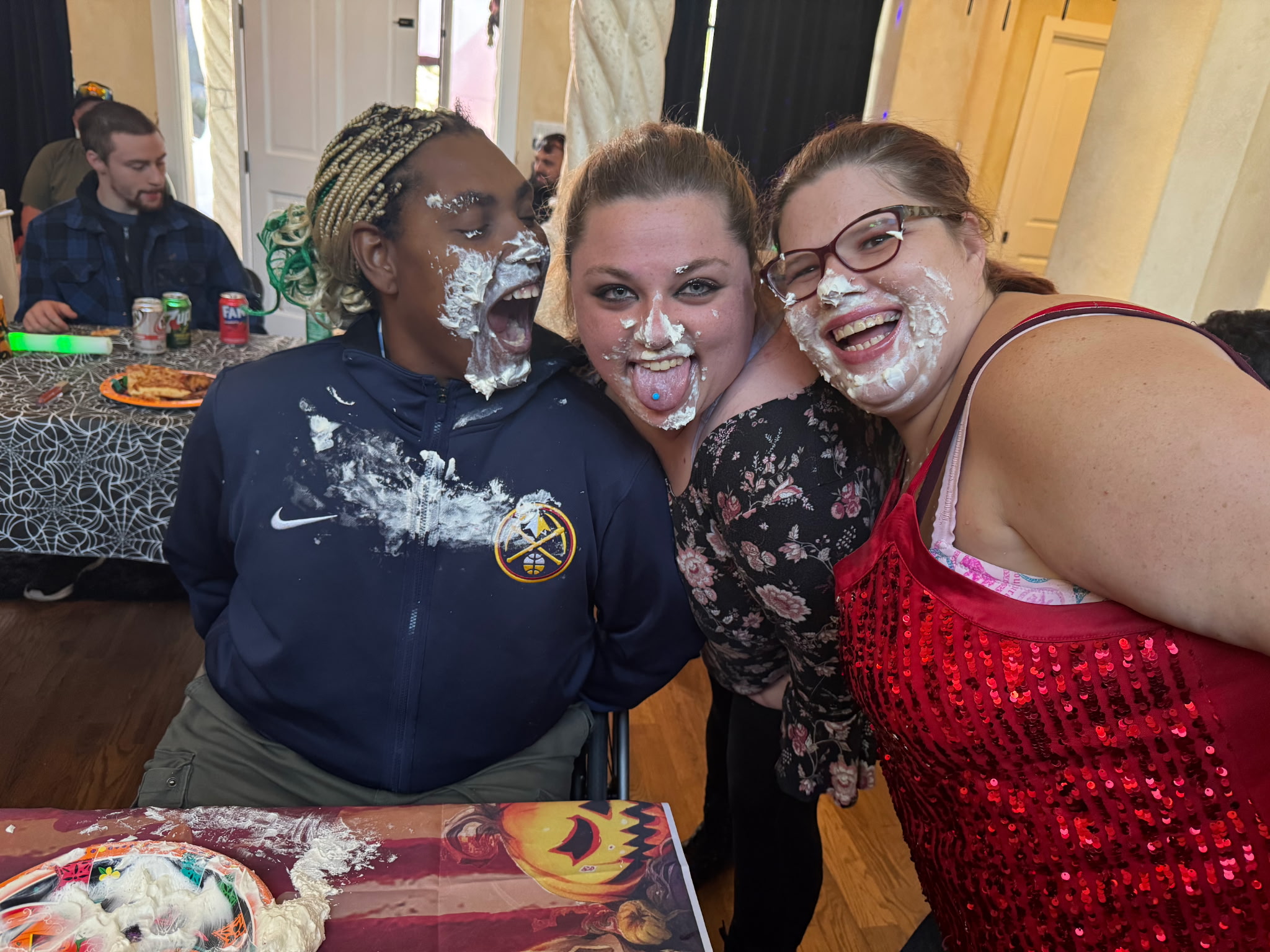 Brighter Horizon clients laughing together at a community Halloween party
