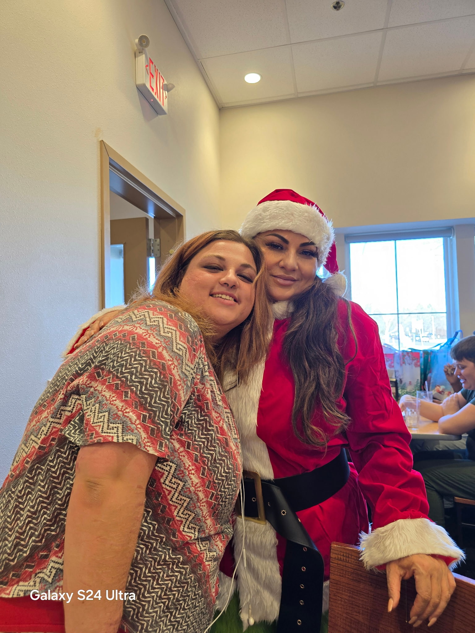 A Brighter Horizon client and host home provider sharing a warm moment at a holiday gathering